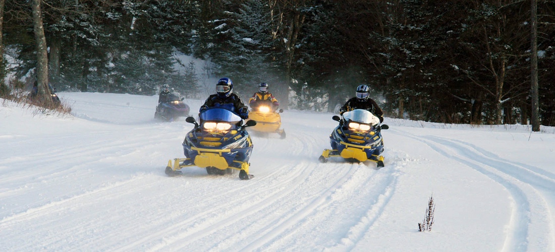 Hundreds of miles of trails keep snow machines entertained throughout the winter months in New Hampshire.