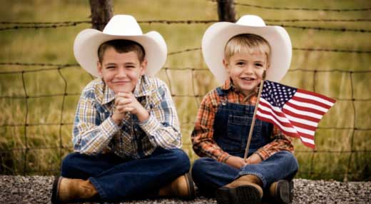 Boys waiting on the parade with flags