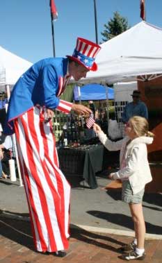 Super Sam meets with people at Street Fairs