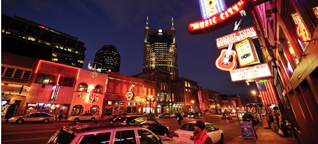 Nashville’s famous honky-tonks are an ideal destination for music fans, food lovers, and whiskey drinkers. One of the most well-known, unique nightlife destinations in Nashville is the three-block strip where Broadway and 5th Avenue intersects with Broadway and 2nd Avenue. Also referred to as “Lo-Bro,” “Honky-Tonk Row”, and “The District”, this is a must-visit area on any trip to Nashville and is located just blocks away from Hampton Inn & Suites Nashville Downtown. There’s a honky-tonk for just about everyone in Nashville, so use our list to find the bars that are perfect for you!